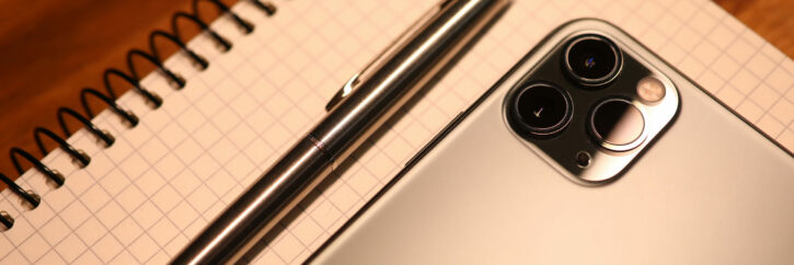 Apple iphone pro on notebook keyboard